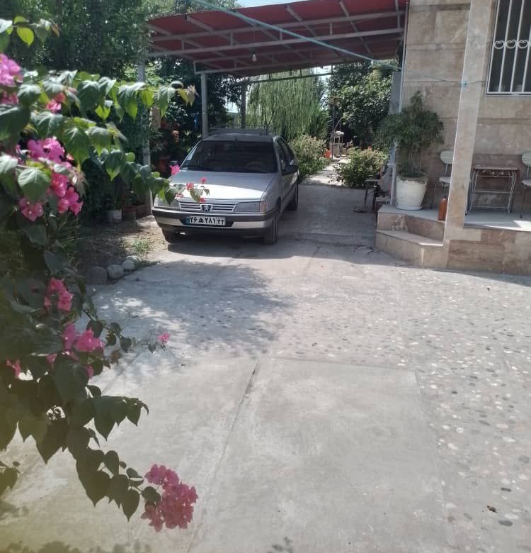 ویلا باغ 600 متری در جاده آمل به سرخرود نمای حیاط و پارکینگ