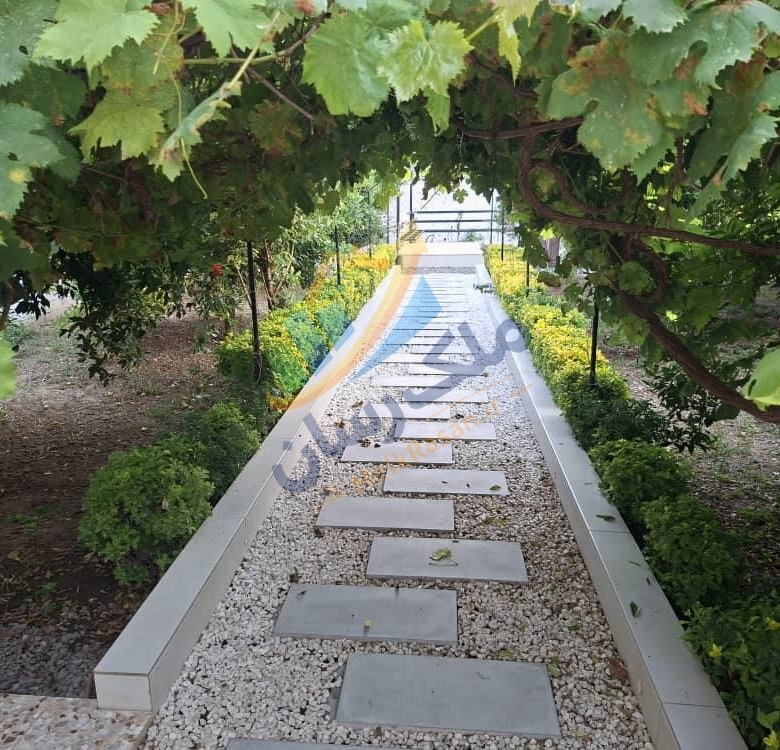 ویلاباغ ۵۵۰ متری سنددار با حیاط‌سازی زیبا در جاده آمل به بابل، منطقه جنگلی، ۸۰ متر بنا نمای حیاط
